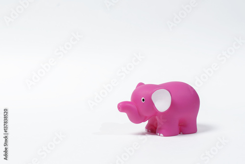 Pink elephant toy isolated on white background.