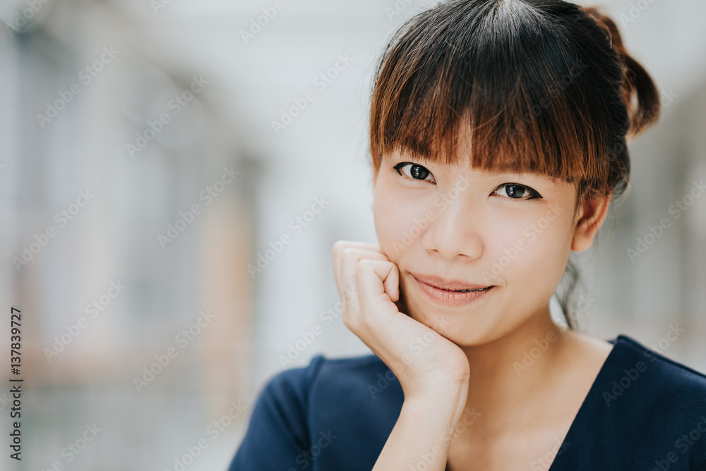 Portrait of young happy Asian girl smiling indoor Portrait of young happy Asian girl smiling indoor