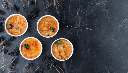 Fotografie Creme brulee in a white bowl with sugar crust