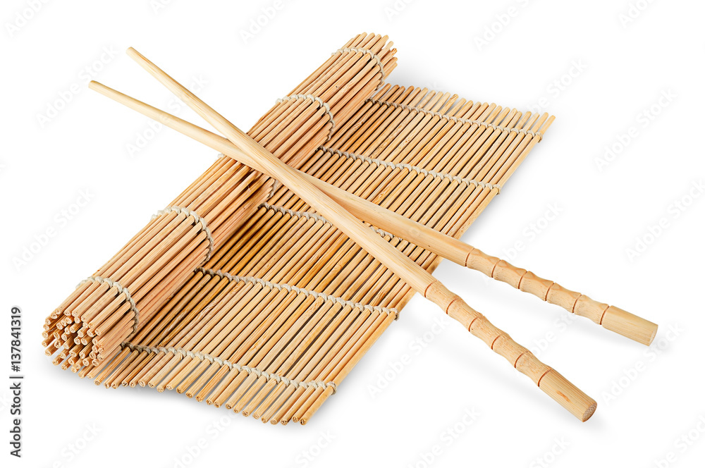 Sushi mat partially deployed and chopsticks Sushi mat partially deployed and chopsticks