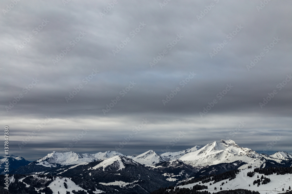 Mountains covered with snow and surrounded by clouds Mountains covered with snow and surrounded by clouds