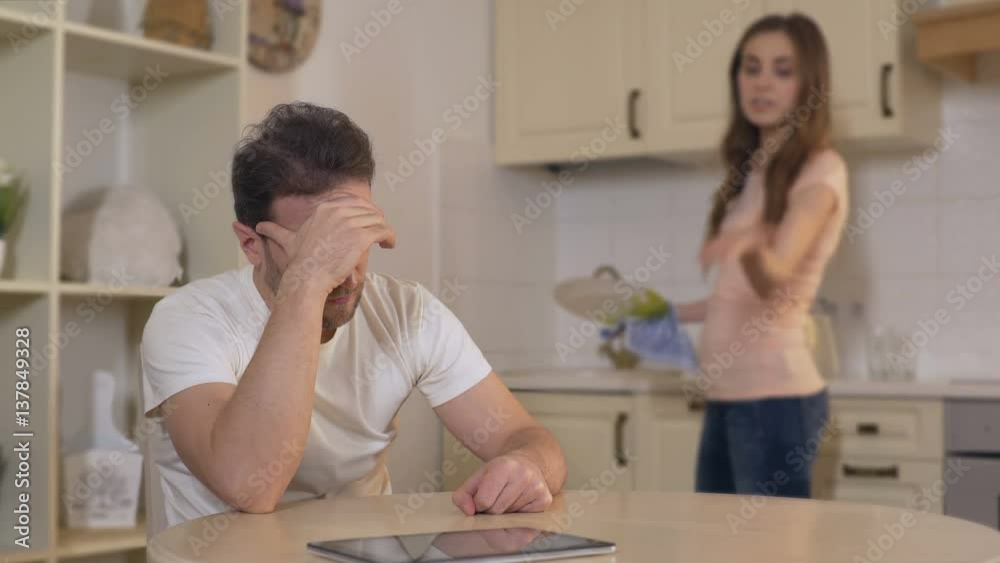 Nervous young woman quarreling with man, annoyed husband ignoring wife, breakup