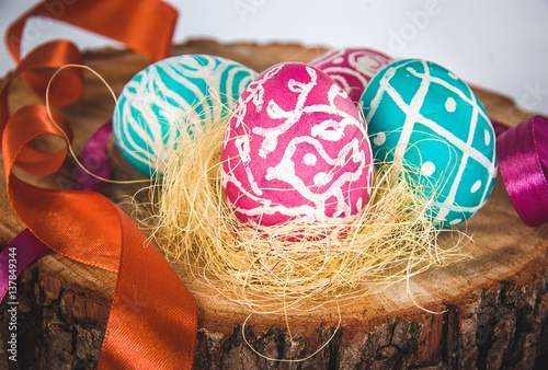 Closeup of beautiful Easter eggs with their hands. A festive mood. 
