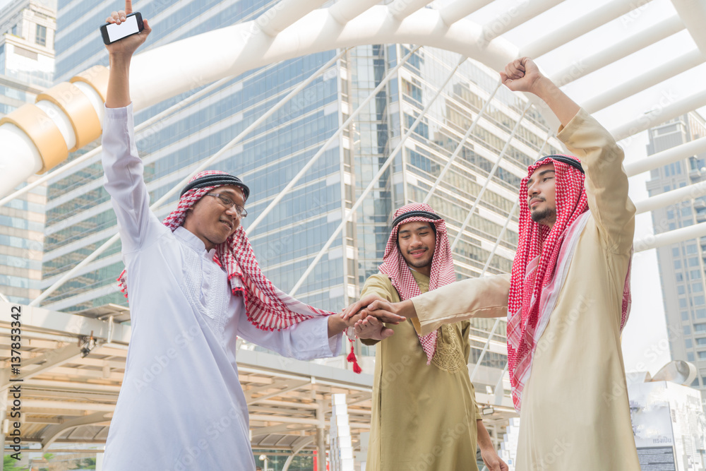 Arabian Businessman shaking hands together with in the city. Concept Team Teamwork Shake Hands Partnership.