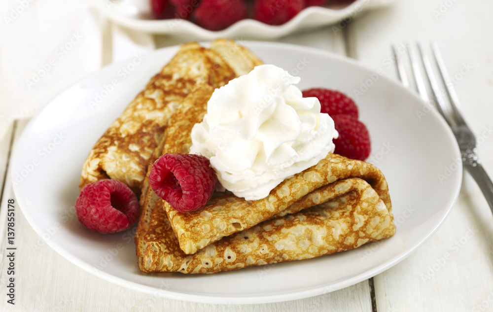 Crepes with raspberries and whipped cream Crepes with raspberries and whipped cream