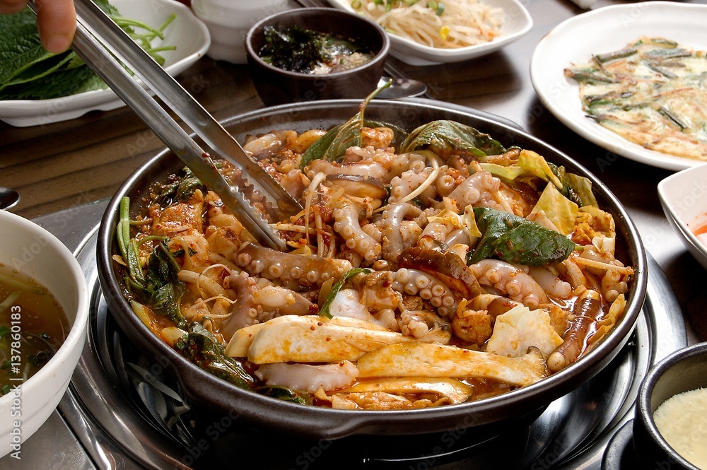 small octopus with grilled pork belly. Nakji and samgyeopsal. small octopus with grilled pork belly. Nakji and samgyeopsal.