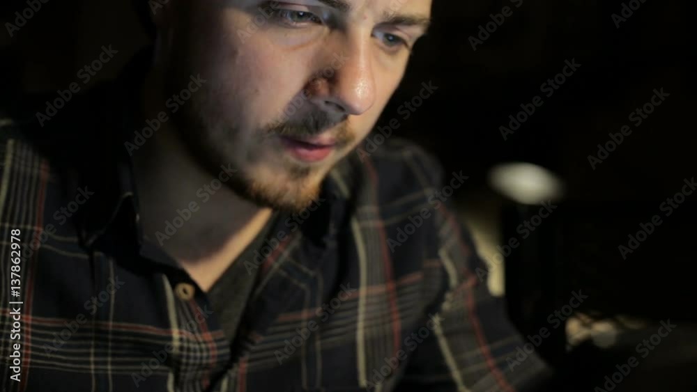 Man using smartphone and drinking tee in cafe Man using smartphone and drinking tee in cafe