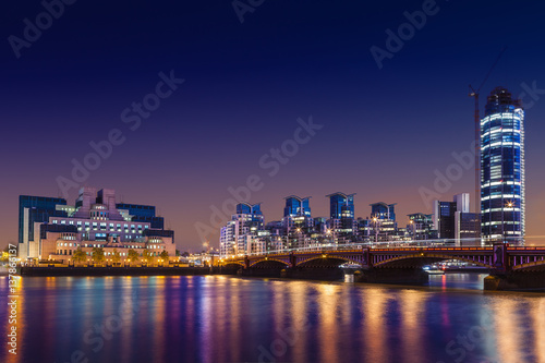MI6 Building, St George Wharf, The Tower and Vauxhall Bridge on the Thames at night, London, UK photo