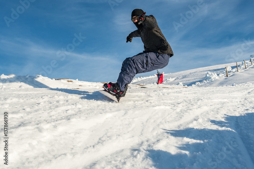 Snowboard freerider in the mountains