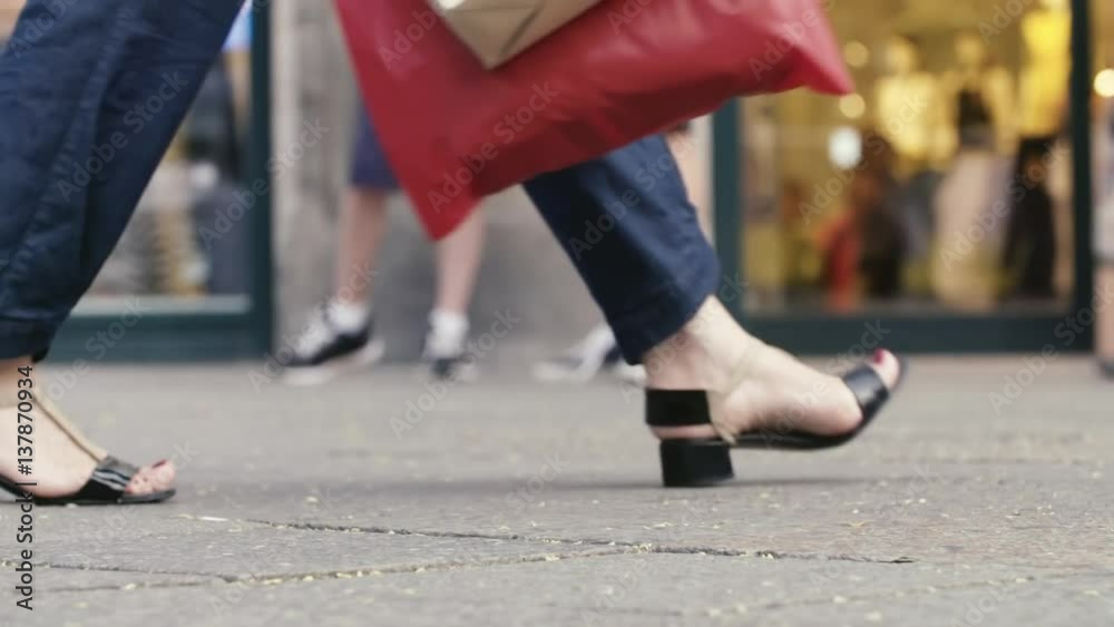 Summer Slow Motion in Shopping Woman with Bag, Low angle shot in front of a Shop on a Street. Summer Slow Motion in Shopping Woman with Bag, Low angle shot in front of a Shop on a Street.