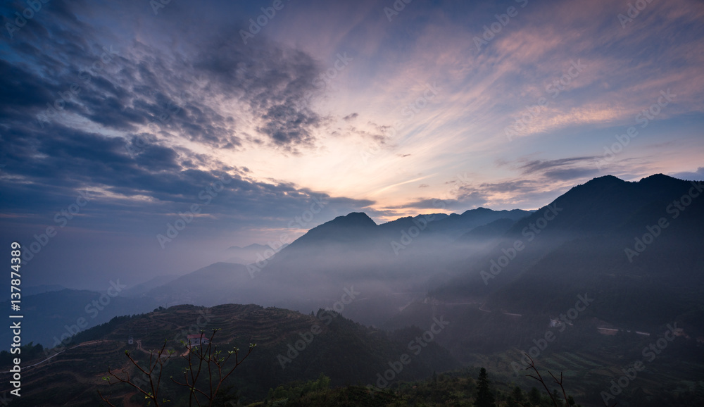 view of foggy mountain landscape at sunrise in China.