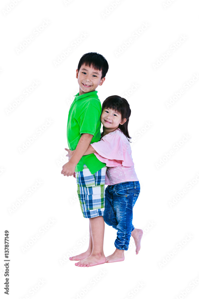 Asian sister standing and hugging his brother smiling happily, isolated on white background. Asian sister standing and hugging his brother smiling happily, isolated on white background.
