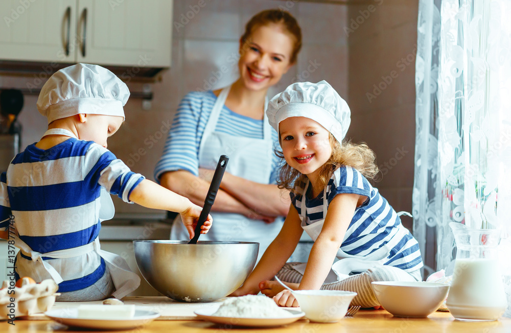 happy family in kitchen. mother and children preparing dough, bake cookies happy family in kitchen. mother and children preparing dough, bake cookies