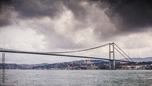 Fototapeta Naklejka Na Ścianę i Meble -  Bosphorus bridge view of Istanbul, Turkey. Dramatic cloudy sky