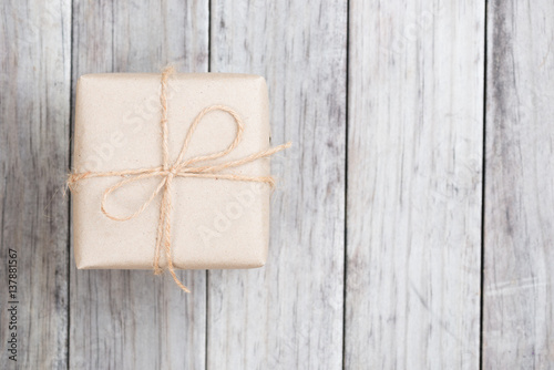 Cardboard box on a wooden background, Brown mail package parcel wrap delivery © teen00000