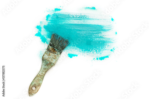 Abstract background with teal blue paint strokes and brush