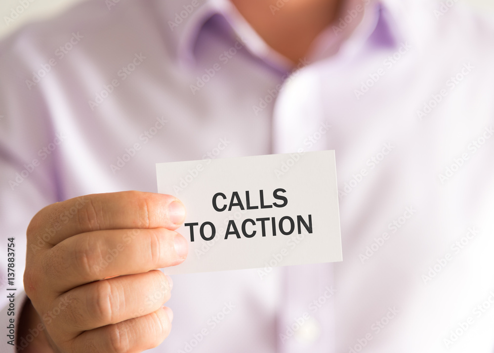 Businessman holding a card with text CALLS TO ACTION Businessman holding a card with text CALLS TO ACTION