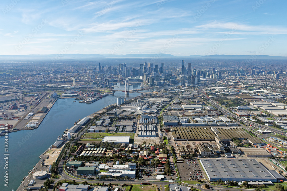 Fototapeta premium Industrial Melbourne: Docklands and CBD skyline viewed from above Port Melbourne