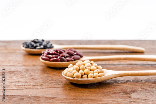 Soy beans, Kidney beans, black beans on dark wooden background