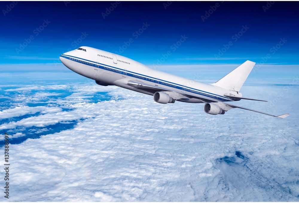 Fototapeta premium passenger airplane in the clouds. travel by air transport. flying to the top of the airliner. nobody