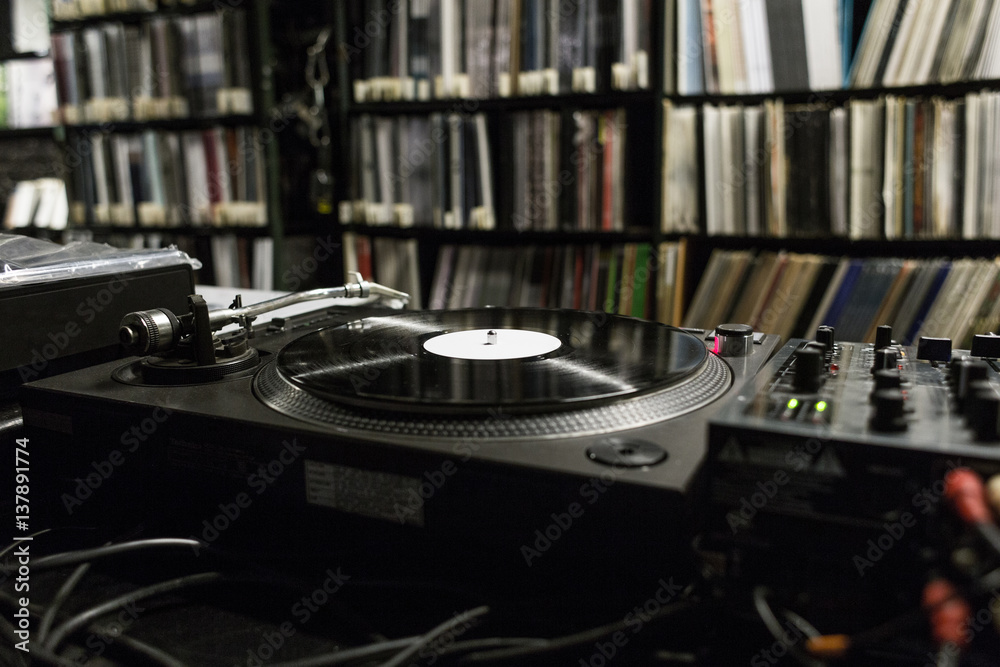 Fototapeta premium DJ Turntable Playing Vinyl at Record Store