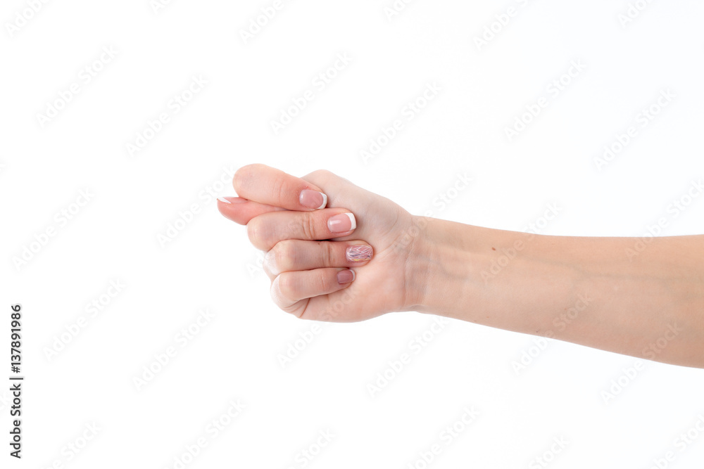 female hand outstretched to the side and showing the gesture producing isolated on white background female hand outstretched to the side and showing the gesture producing isolated on white background