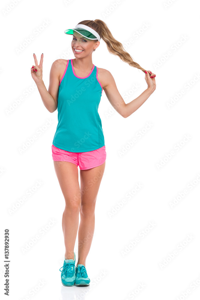 Happy Woman In Sport Clothes Showing Peace Sign Happy Woman In Sport Clothes Showing Peace Sign
