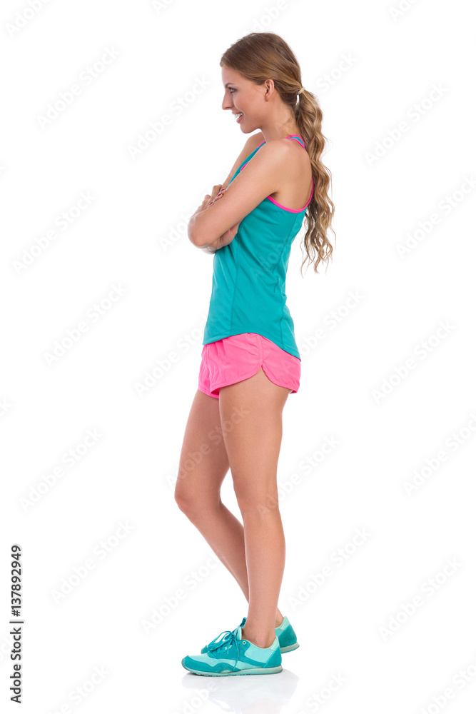 Woman In Vibrant Sports Clothes Side View Isolated Woman In Vibrant Sports Clothes Side View Isolated