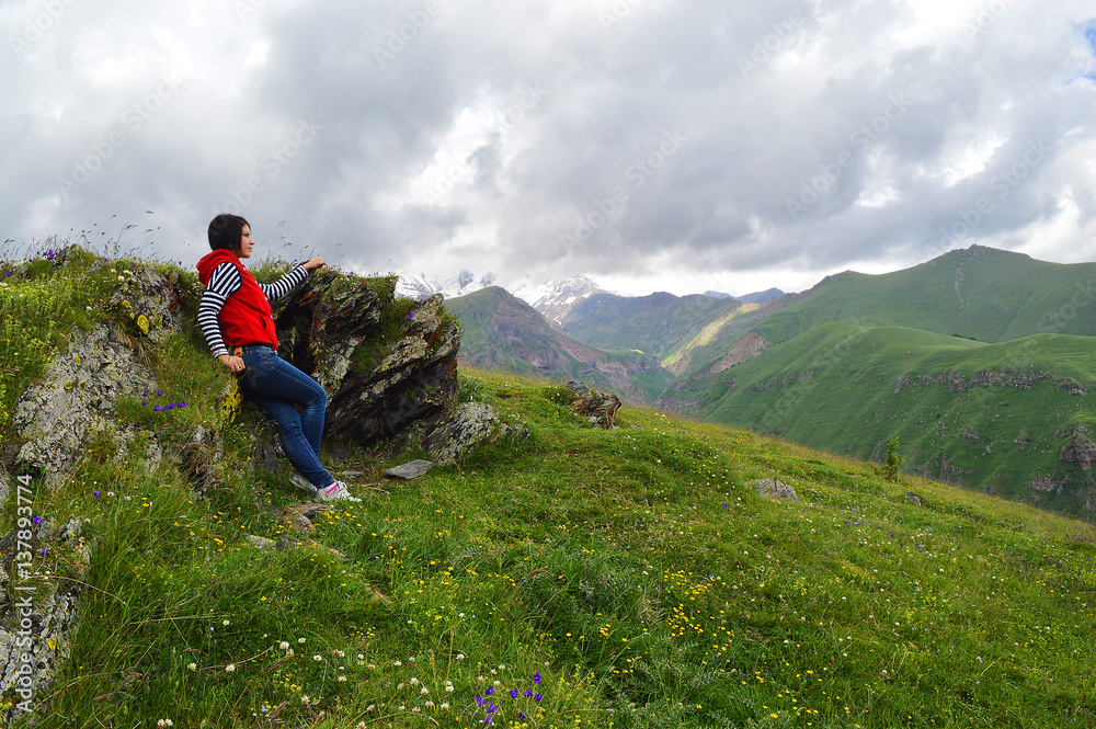 happy tourist on the background of the Caucasus mountains happy tourist on the background of the Caucasus mountains