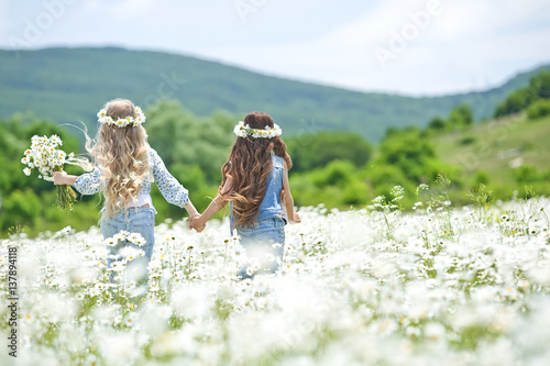 Children in a field of flowers 