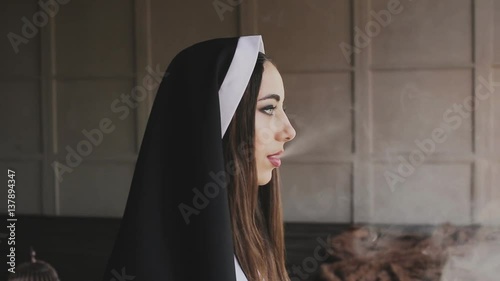 bad nun smoking a cigarette