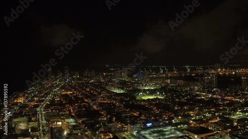 Miami Aerial v42 Flying backwards over Miami Beach panning at night. photo