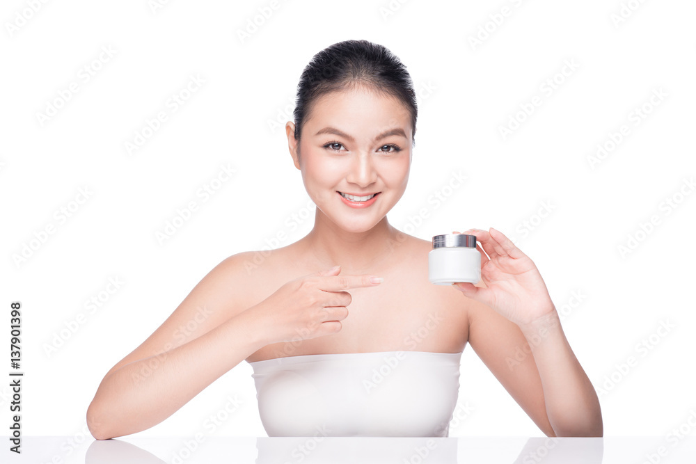 Beauty treatment. Asian woman holding moisturizing cream box. Beauty treatment. Asian woman holding moisturizing cream box.