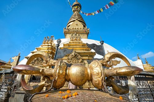 Big golden Vajra weapon in front of the Swayambhunath stupa in Kathmandu, Nepal