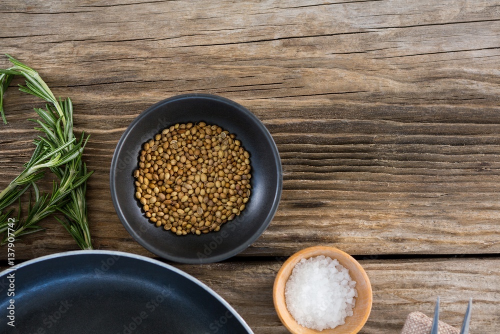 Coriander seeds, salt and rosemary herbs Coriander seeds, salt and rosemary herbs