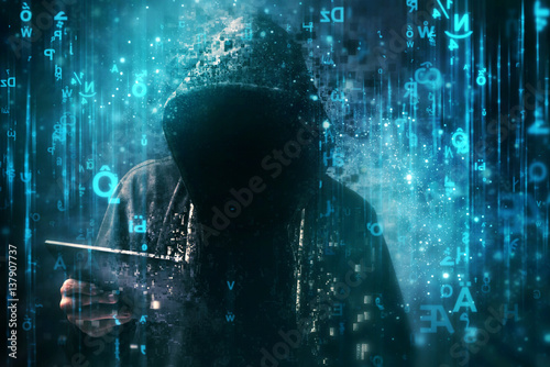 Computer hacker with hoodie in cyberspace surrounded by matrix code