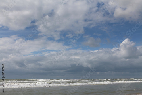 Clouds and waves at the Northsea coast. Julianadorp. Beach. Coast Netherlands