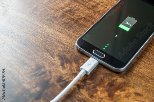 Mobile smartphone charging battery close-up photo