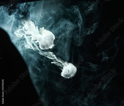 Vape trick smoke ring on dark background