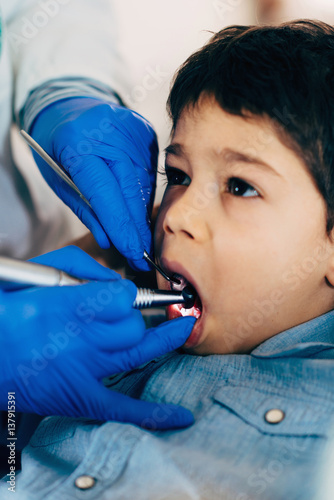 Dental drilling little boy s tooth