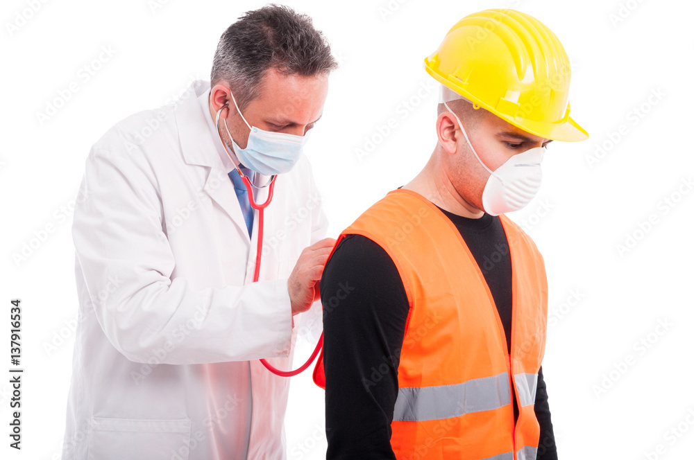 Doctor checking constructors lungs with stethoscope Doctor checking constructors lungs with stethoscope