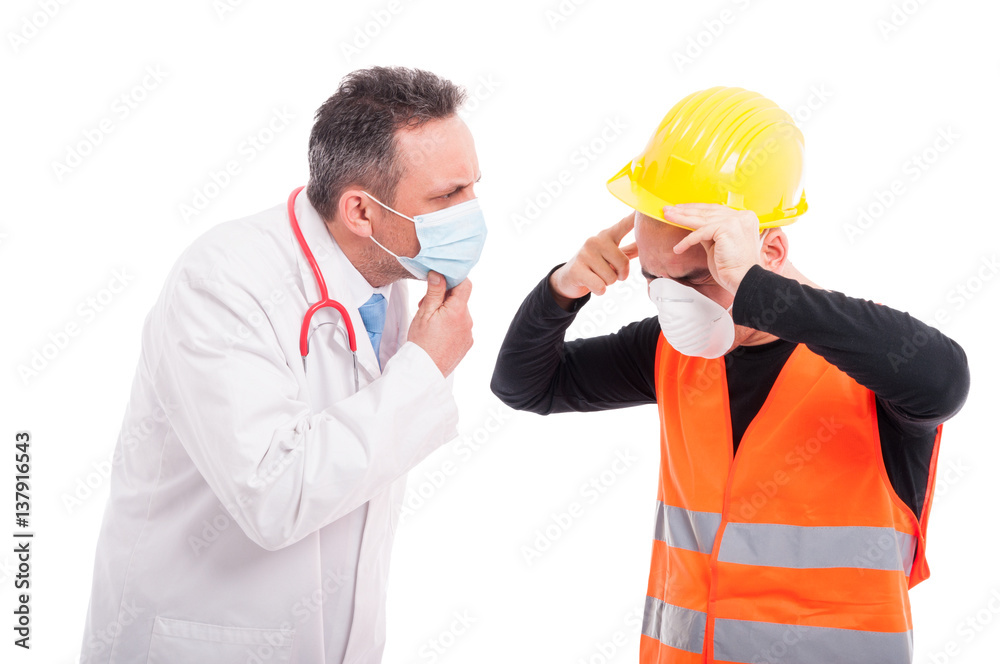 Male doctor looking at constructor head pain injury