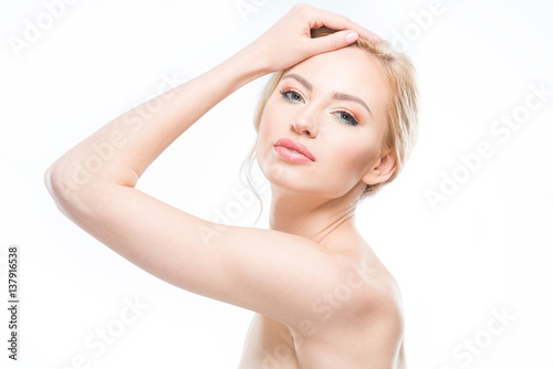 Beautiful blonde woman with stylish makeup posing on white, body care concept