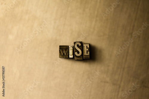 WISE - close-up of grungy vintage typeset word on metal backdrop. Royalty free stock illustration.  Can be used for online banner ads and direct mail.