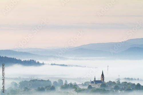 Fog rising from the meadows at dawn near Lutowiska, Bieszczady National Park, Poland, September 2011 photo