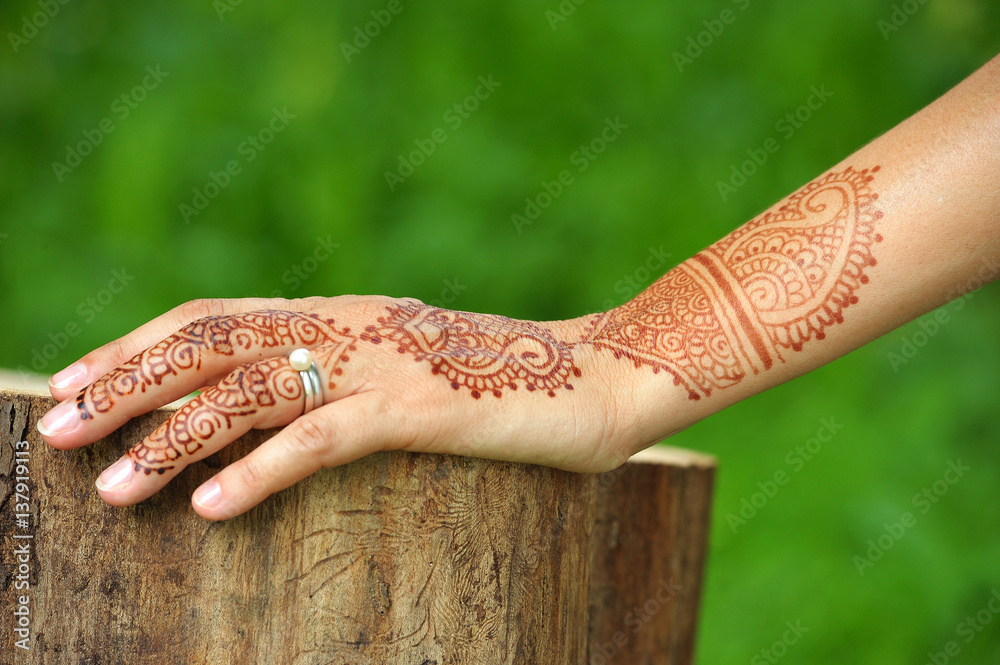 Tattoo. Henna. Woman hand. India. Outdoors. Wood and park Stock Photo |  Adobe Stock