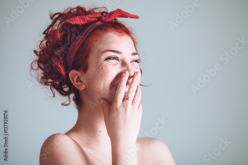 Portrait of beautiful young woman laughing
 photo