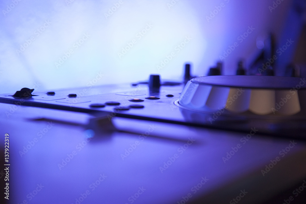 close up of a music console with blue led light close up of a music console with blue led light