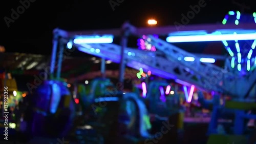 Blur carousel at an amusement park at night.