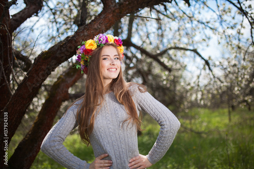 Beautiful smiling Woman Fashion Model with Apple Tree Flowers